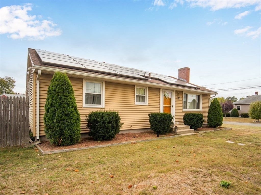91 Arcadia Boulevard Springfield, MA 01118 - Photo 1 of 34 a front view of a house with a yard