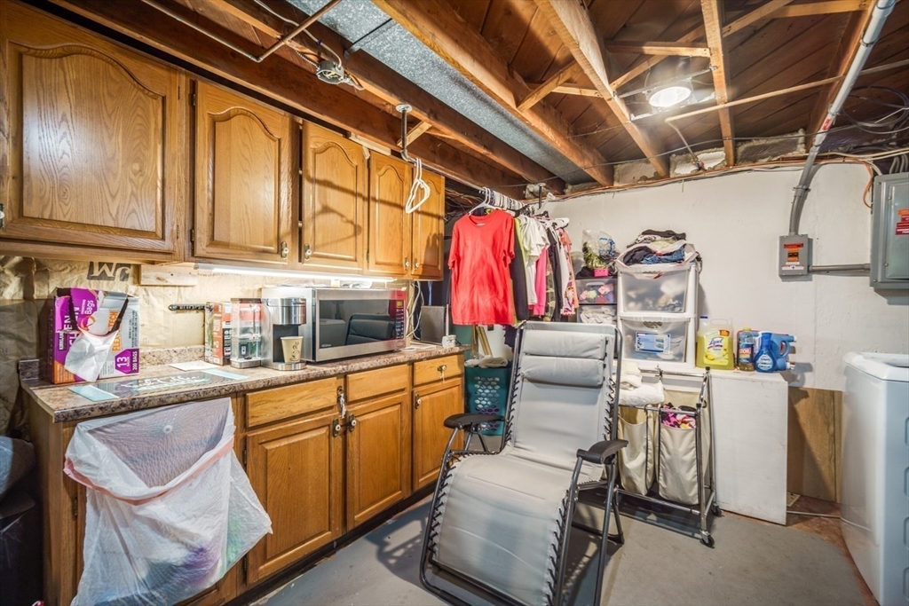 91 Arcadia Boulevard Springfield, MA 01118 - Photo 30 of 34 a utility room with cabinets dryer and washer