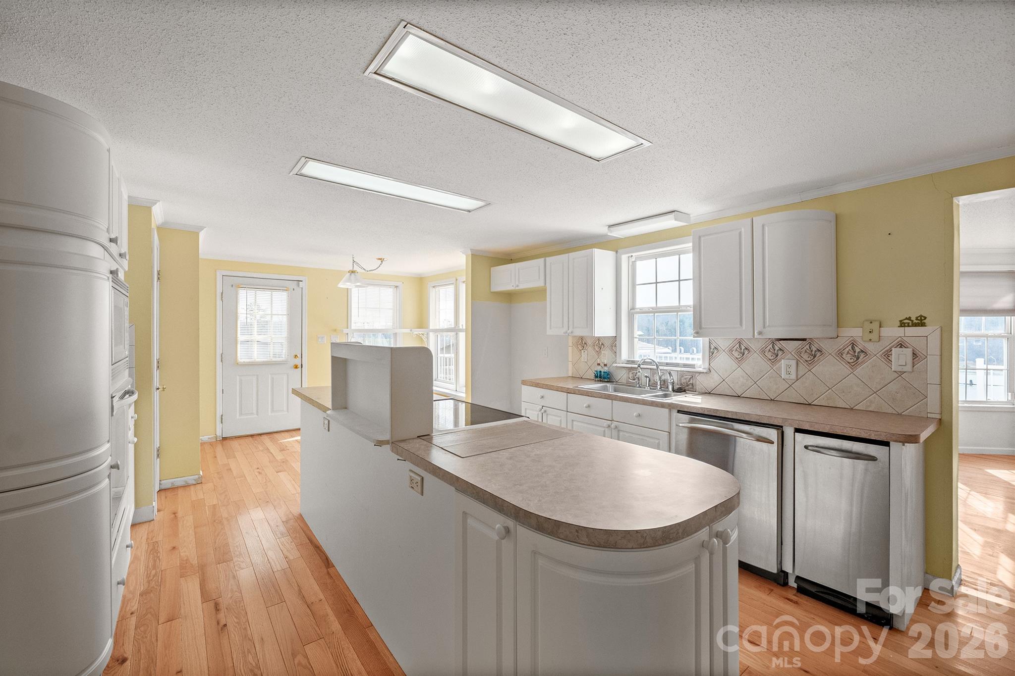 2991 Sam Houser Road Vale, NC 28168 - Photo 11 of 48 a kitchen with a sink stove and refrigerator
