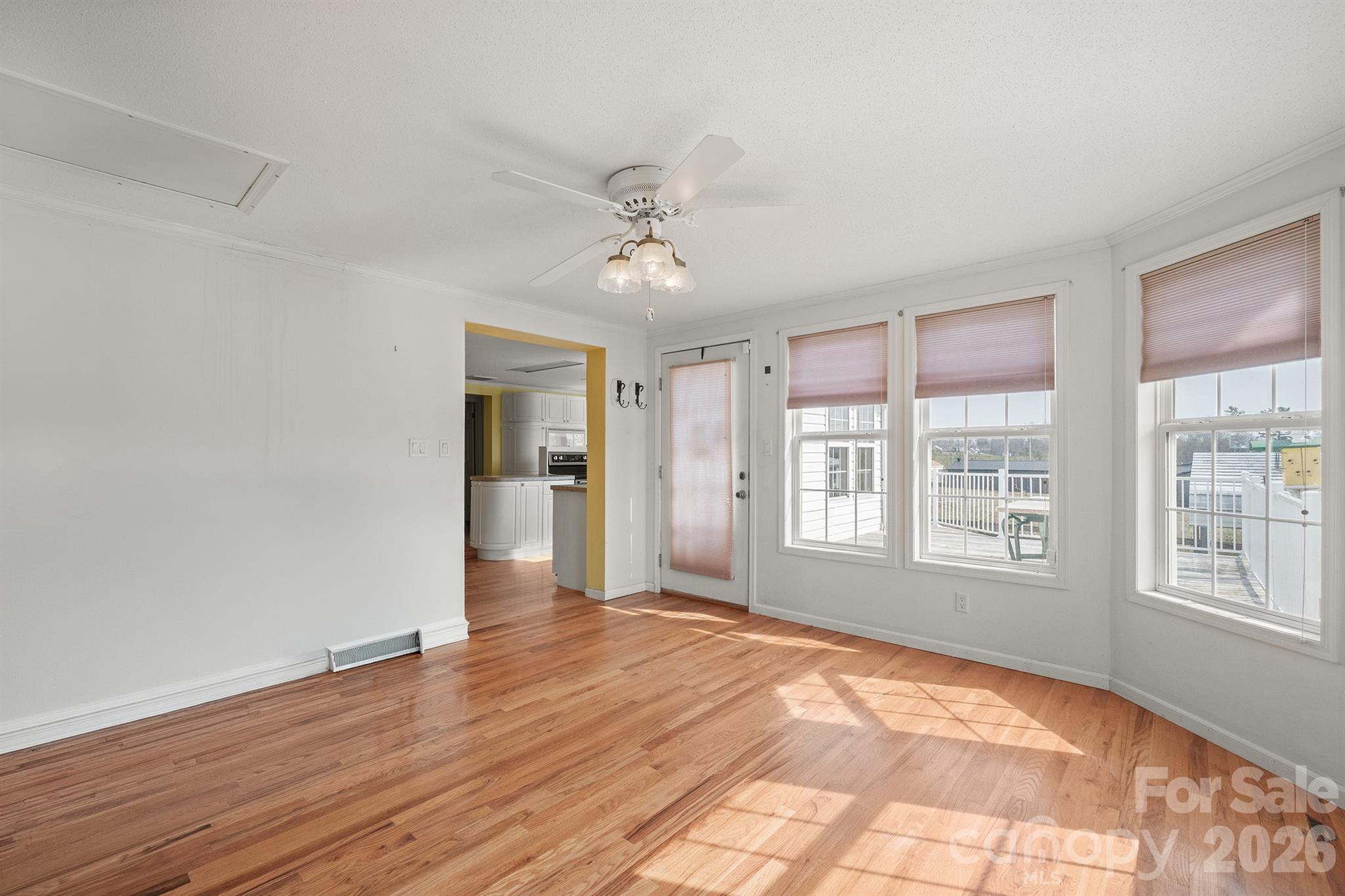 2991 Sam Houser Road Vale, NC 28168 - Photo 20 of 48 a view of an empty room with a window and wooden floor