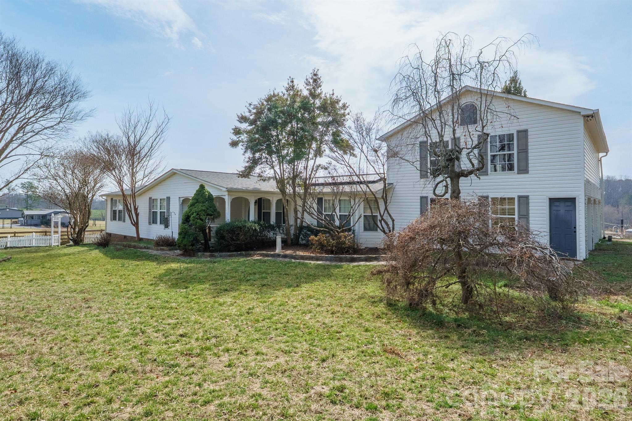2991 Sam Houser Road Vale, NC 28168 - Photo 2 of 48 a front view of a house with a yard