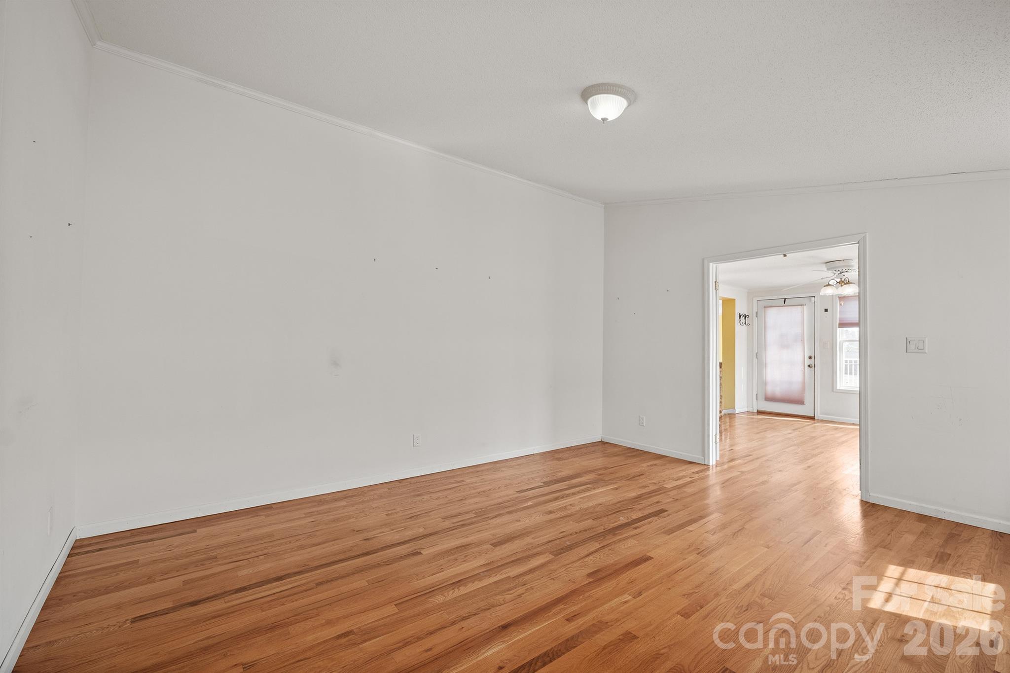2991 Sam Houser Road Vale, NC 28168 - Photo 23 of 48 a view of an empty room with wooden floor