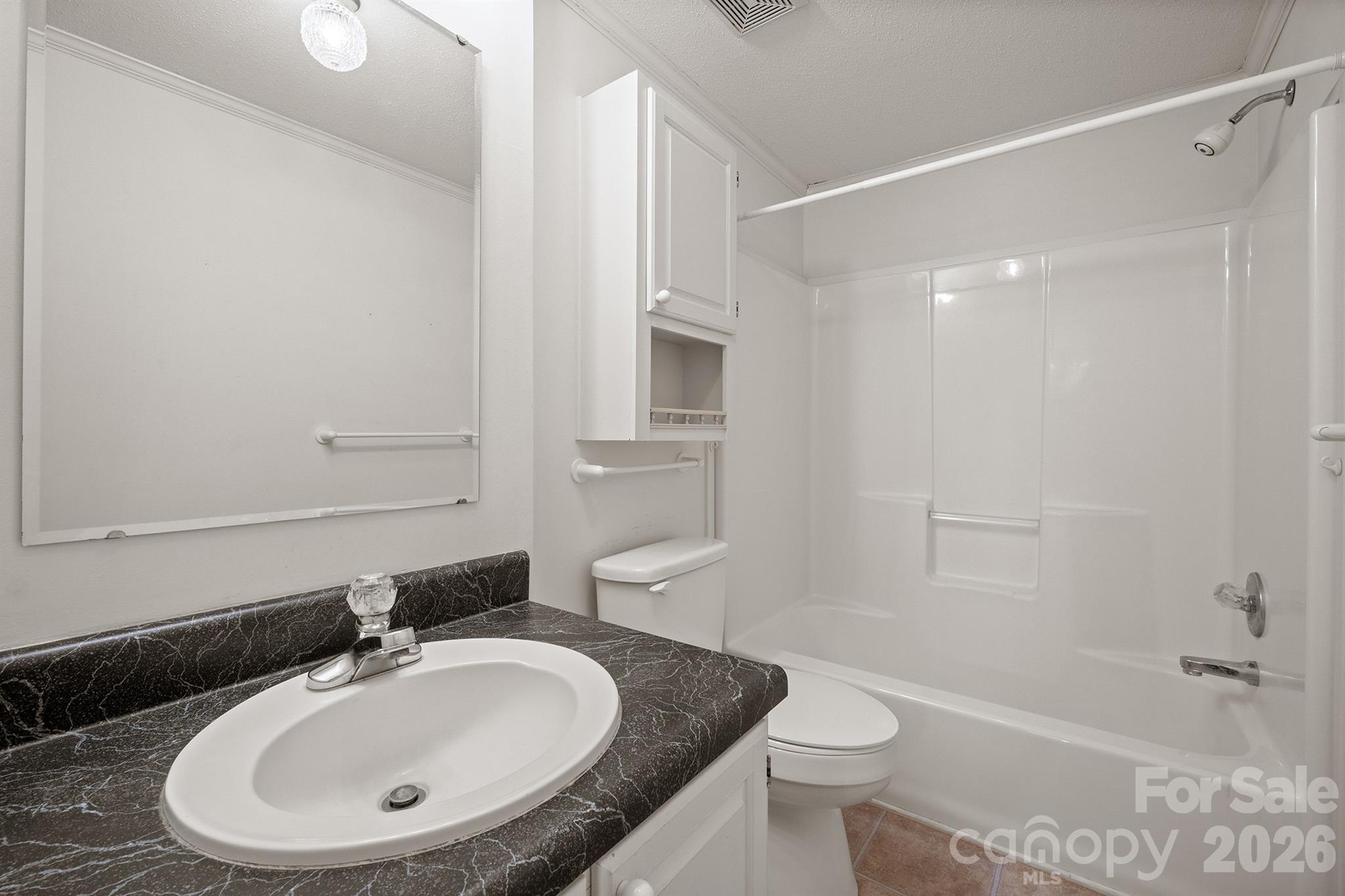 2991 Sam Houser Road Vale, NC 28168 - Photo 29 of 48 a bathroom with a sink a toilet and shower