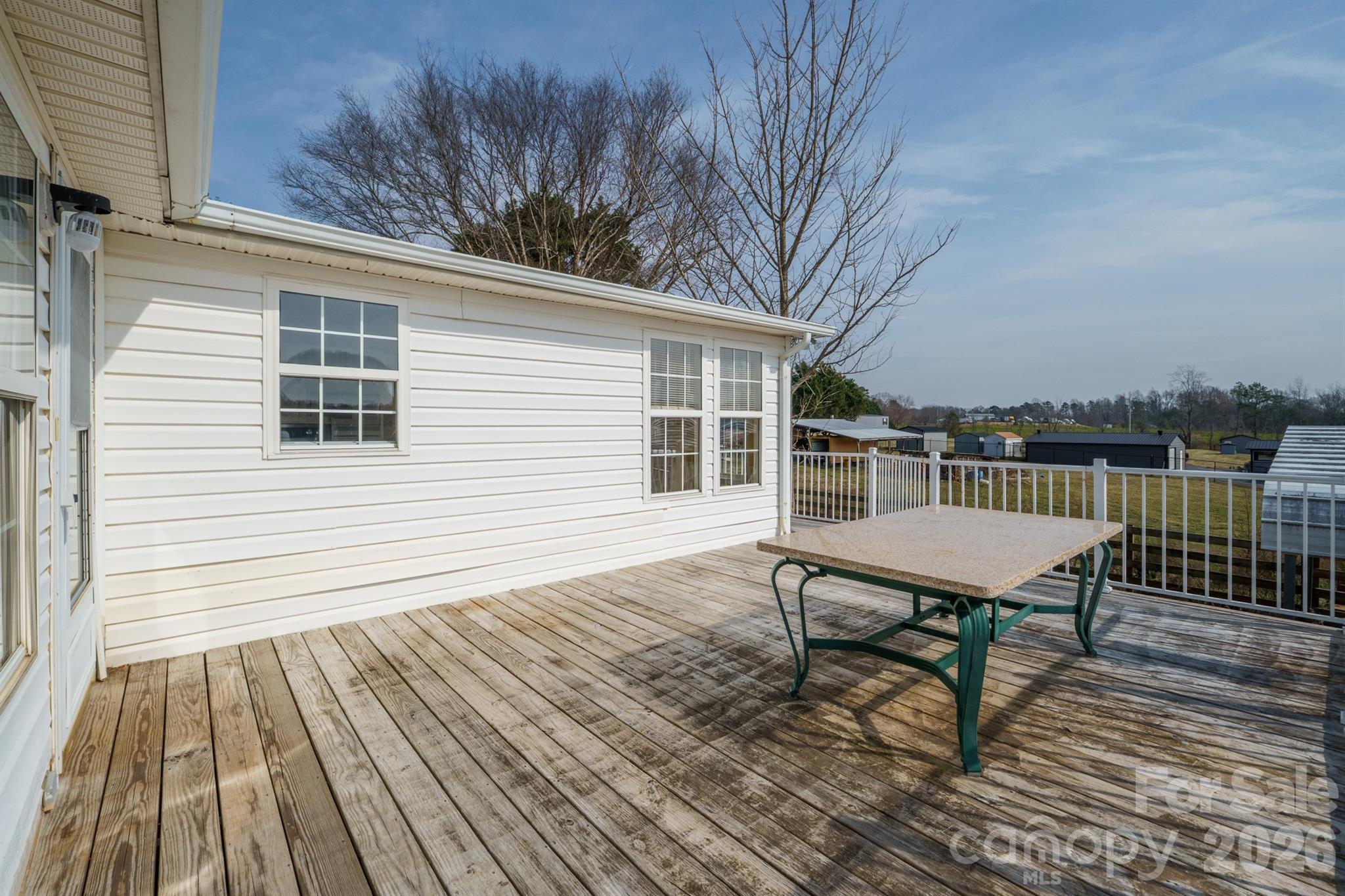 2991 Sam Houser Road Vale, NC 28168 - Photo 40 of 48 a view of a roof deck with wooden floor and fence