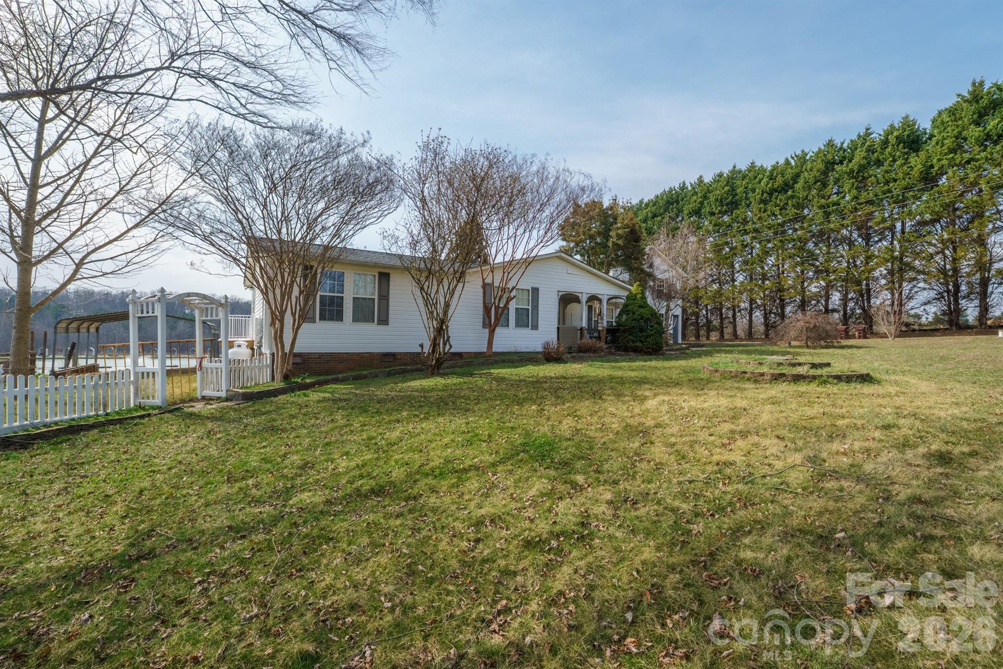 2991 Sam Houser Road Vale, NC 28168 - Photo 4 of 48 a house view with outdoor space