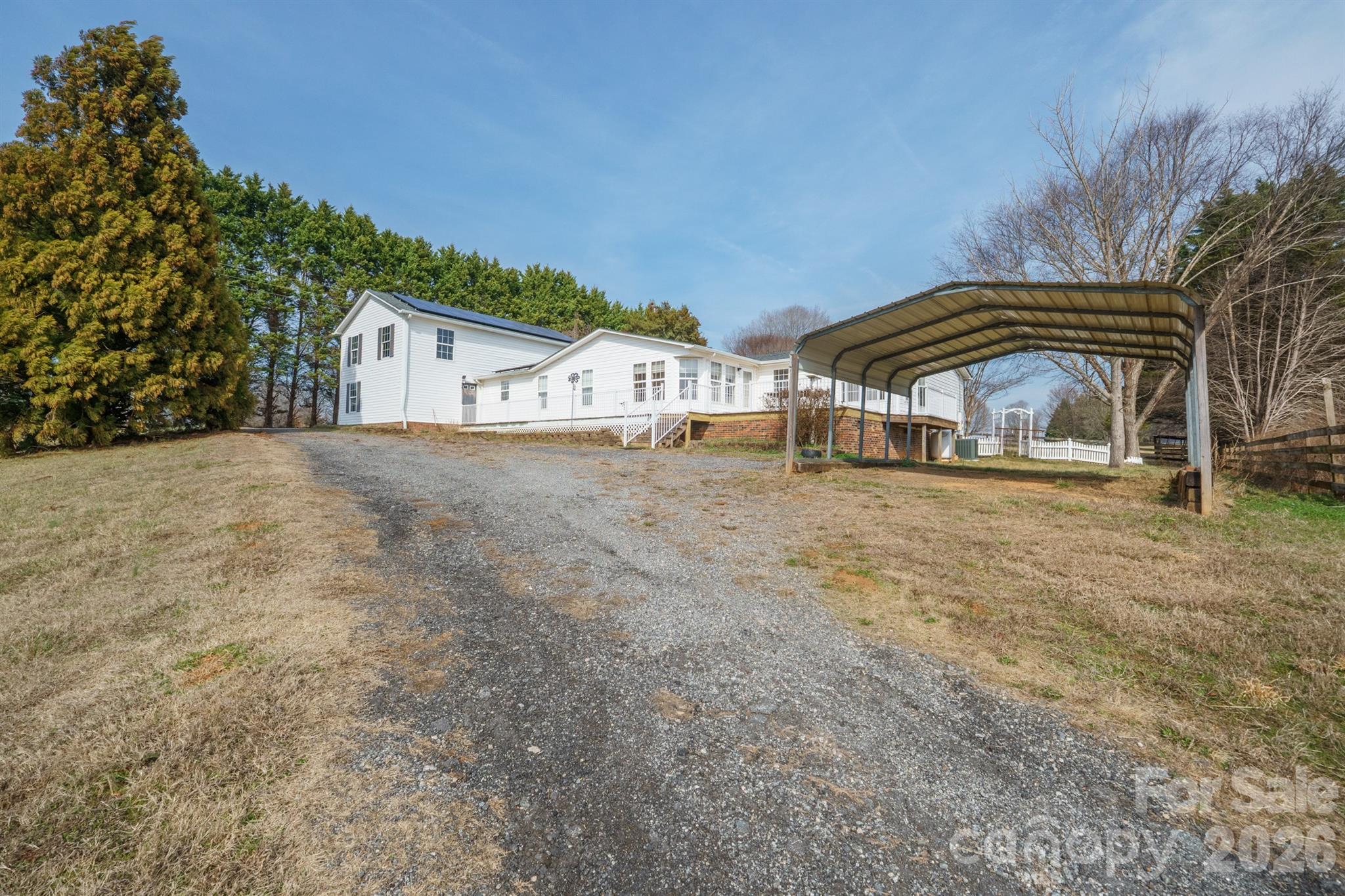 2991 Sam Houser Road Vale, NC 28168 - Photo 41 of 48 a view of a house with a yard and balcony