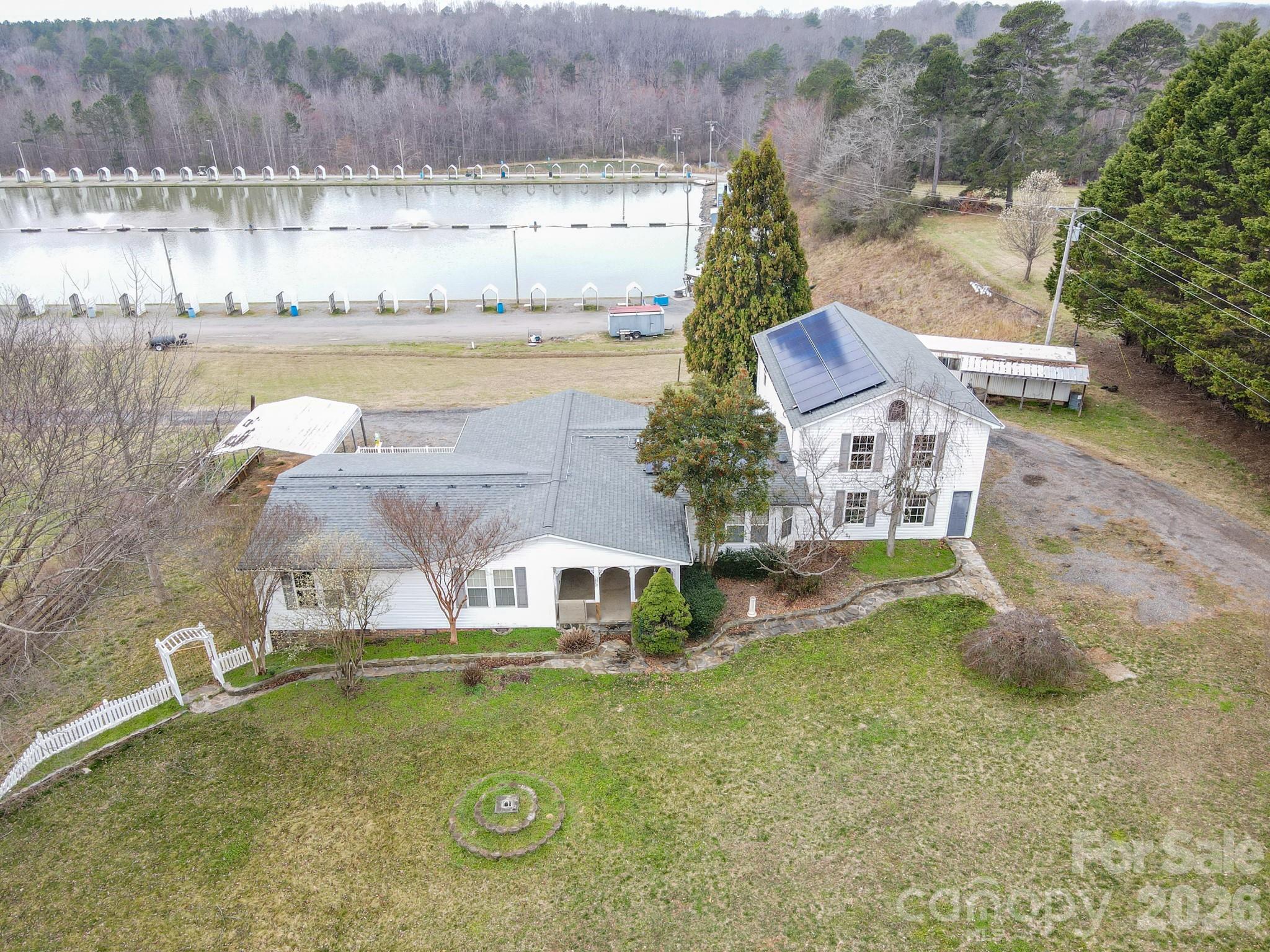 2991 Sam Houser Road Vale, NC 28168 - Photo 47 of 48 a aerial view of a house with outdoor space and lake view