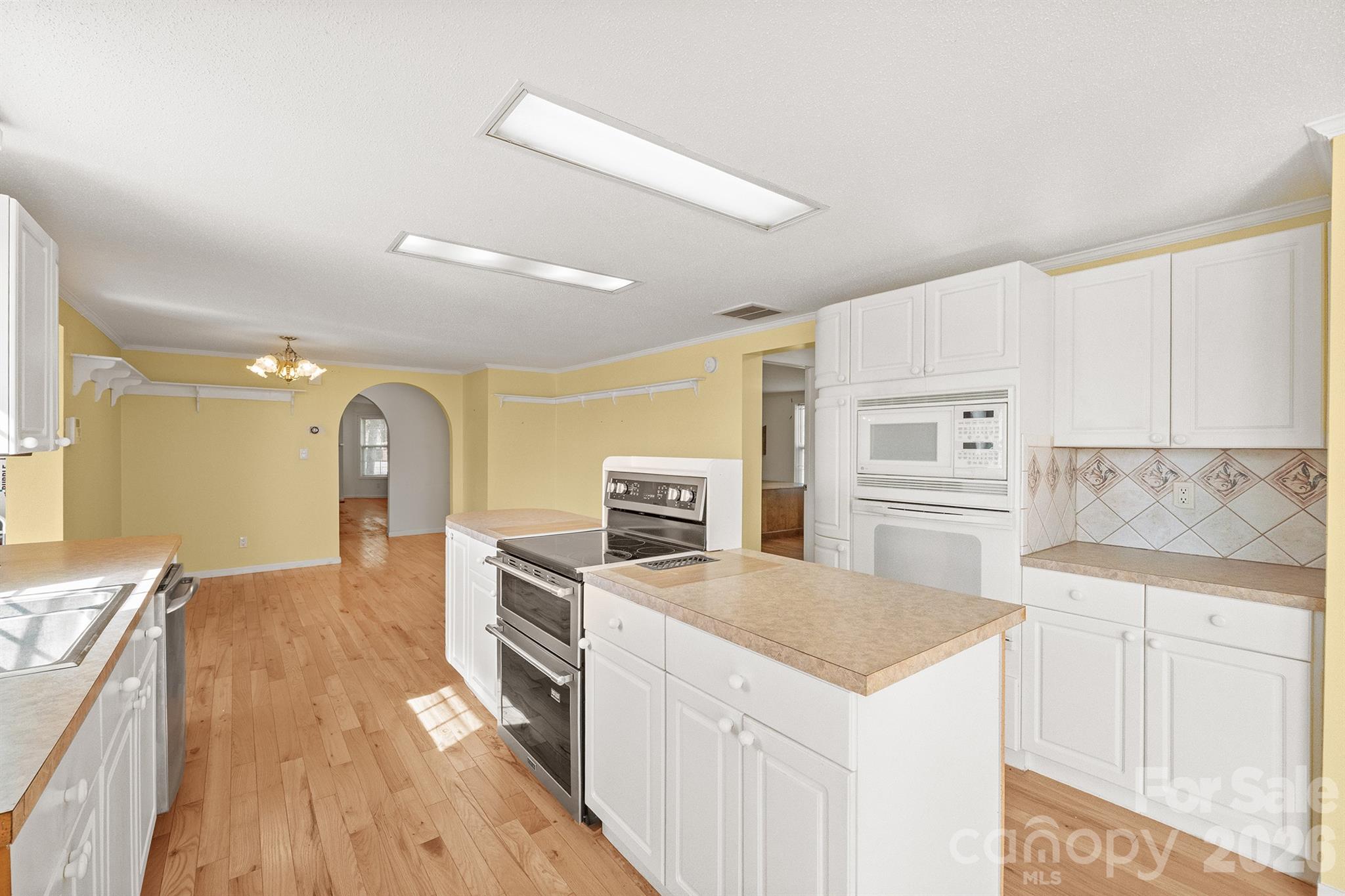 2991 Sam Houser Road Vale, NC 28168 - Photo 9 of 48 a kitchen with granite countertop a sink stove and refrigerator