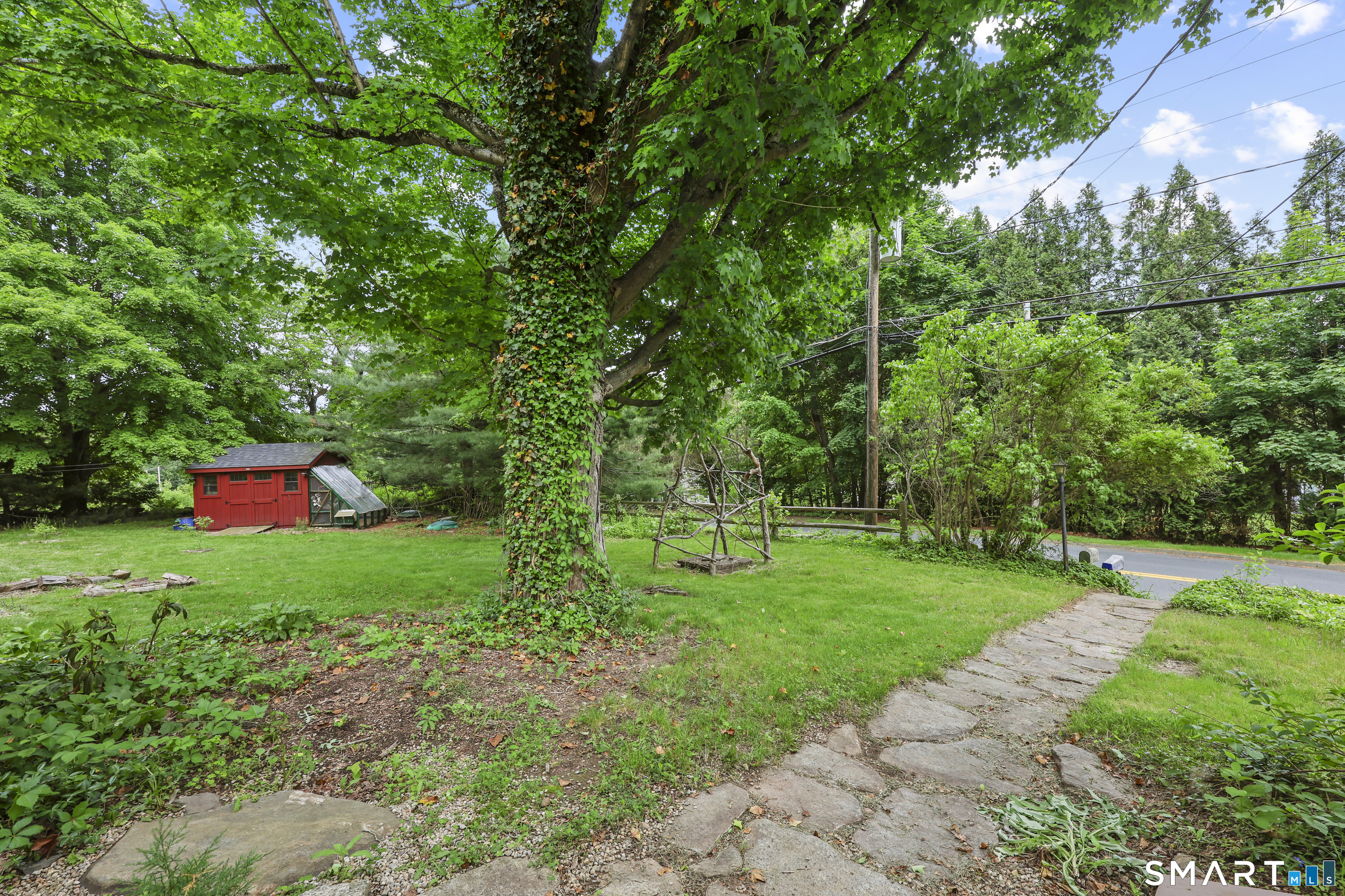 917 Hopewell Road Glastonbury, CT 06033 - Photo 36 of 39 a backyard of a house with lots of green space