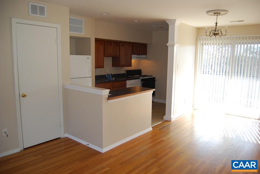 115 Hessian Hills Ridge, Unit 3 Charlottesville, VA 22901 - Photo 1 of 22 a kitchen with a refrigerator and a stove top oven