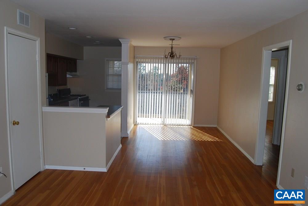 115 Hessian Hills Ridge, Unit 3 Charlottesville, VA 22901 - Photo 2 of 22 a view of a room with wooden floor and a window
