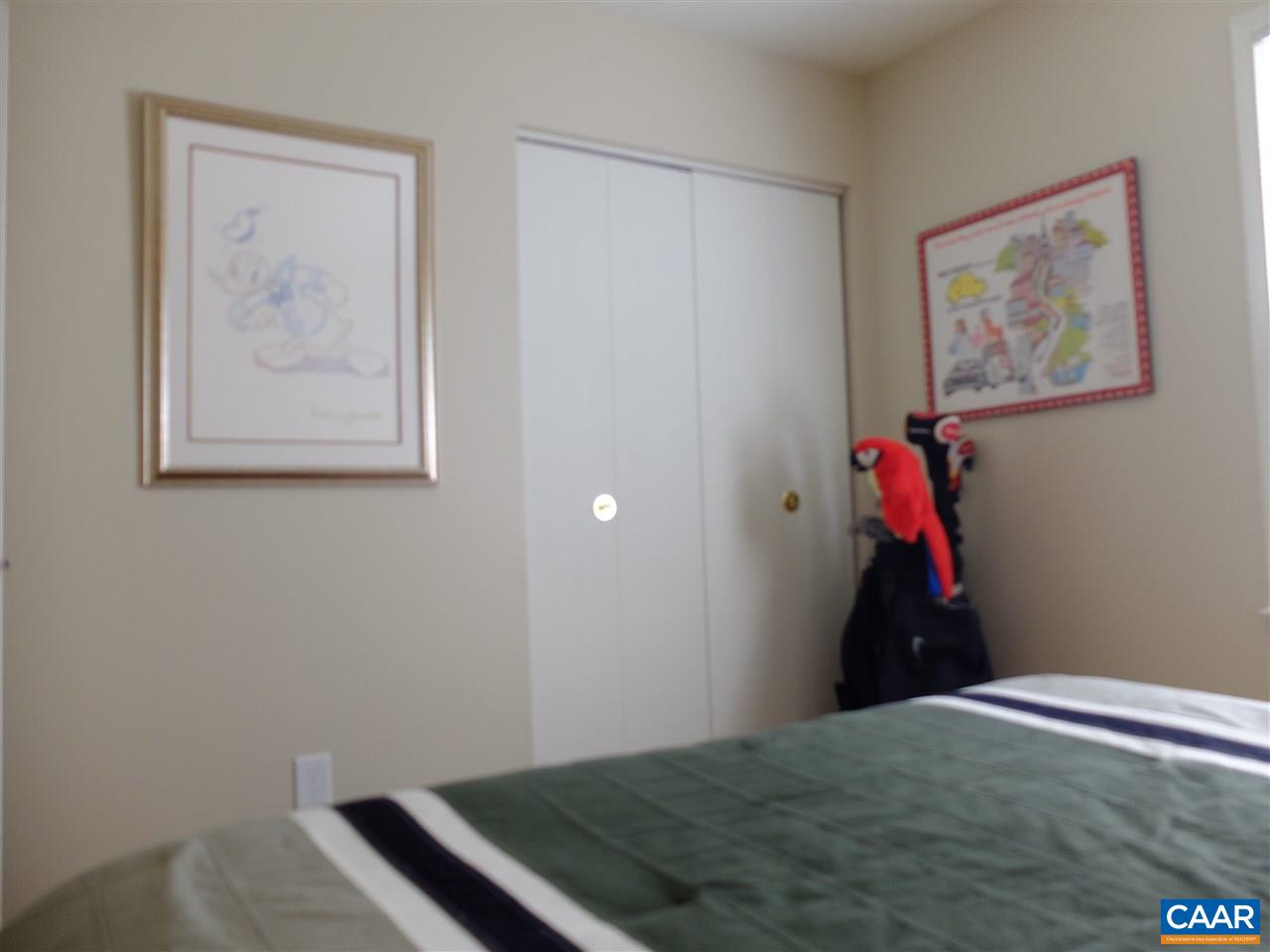 115 Hessian Hills Ridge, Unit 3 Charlottesville, VA 22901 - Photo 5 of 22 a bedroom with a bed and wall painting