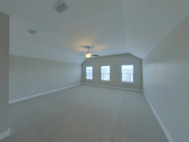 an empty room that has a window in it