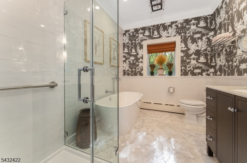 11 New Street Mendham, NJ 07945 - Photo 20 of 35 a bathroom with a granite countertop sink a toilet and shower