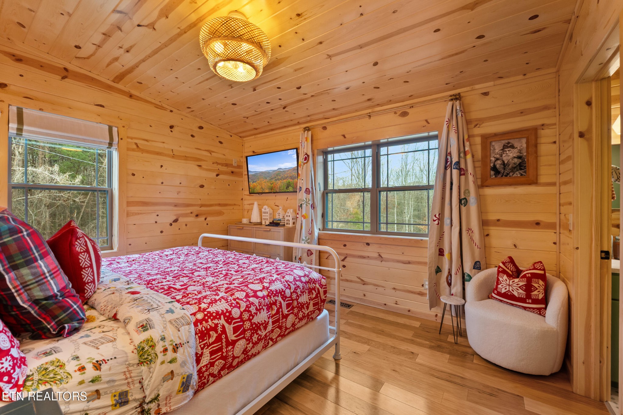 1132 Pinyon Circle Sevierville, TN 37863 - Photo 14 of 25 a bedroom with a bed and wooden floor