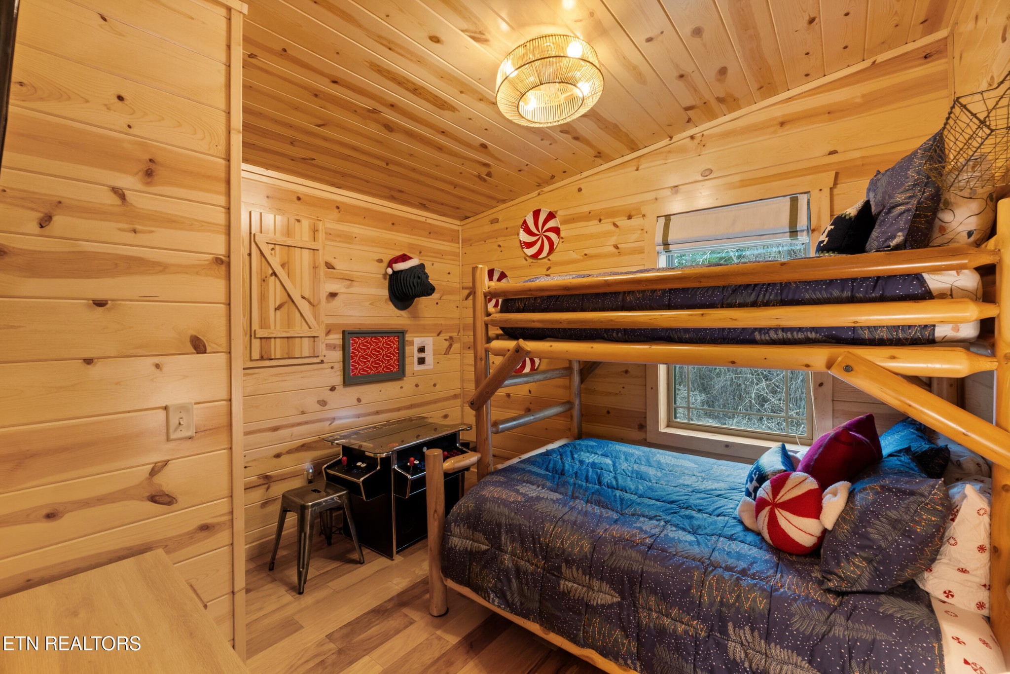 1132 Pinyon Circle Sevierville, TN 37863 - Photo 16 of 25 a bedroom with a bed and wooden floor