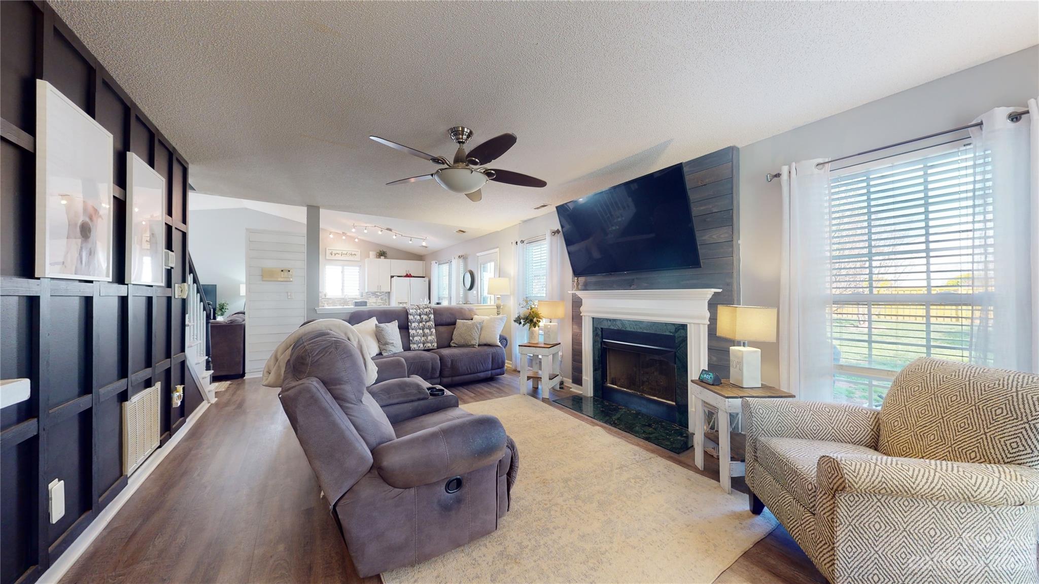 1007 Great Falls Drive Monroe, NC 28110 - Photo 16 of 45 a living room with furniture fireplace and flat screen tv