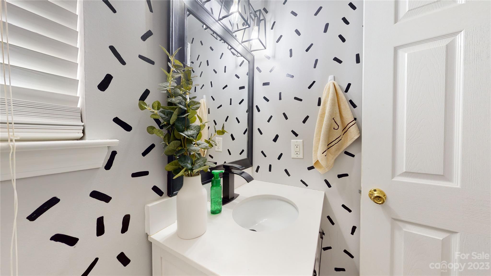 1007 Great Falls Drive Monroe, NC 28110 - Photo 18 of 45 a bathroom with a sink and a mirror