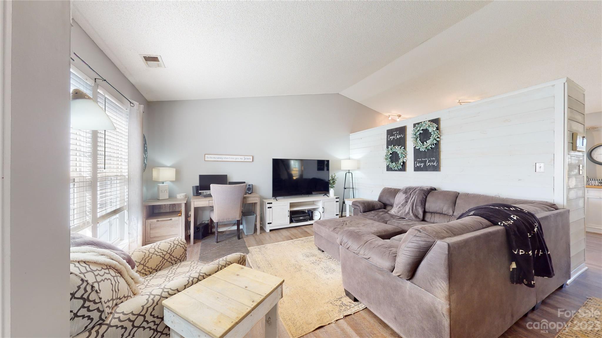 1007 Great Falls Drive Monroe, NC 28110 - Photo 2 of 45 a living room with furniture and a flat screen tv