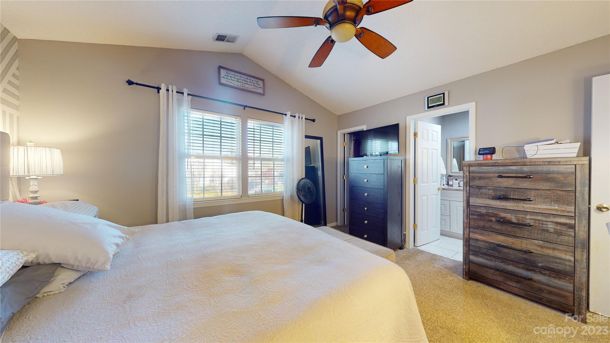 1007 Great Falls Drive Monroe, NC 28110 - Photo 23 of 45 a bedroom with a bed and a chandelier