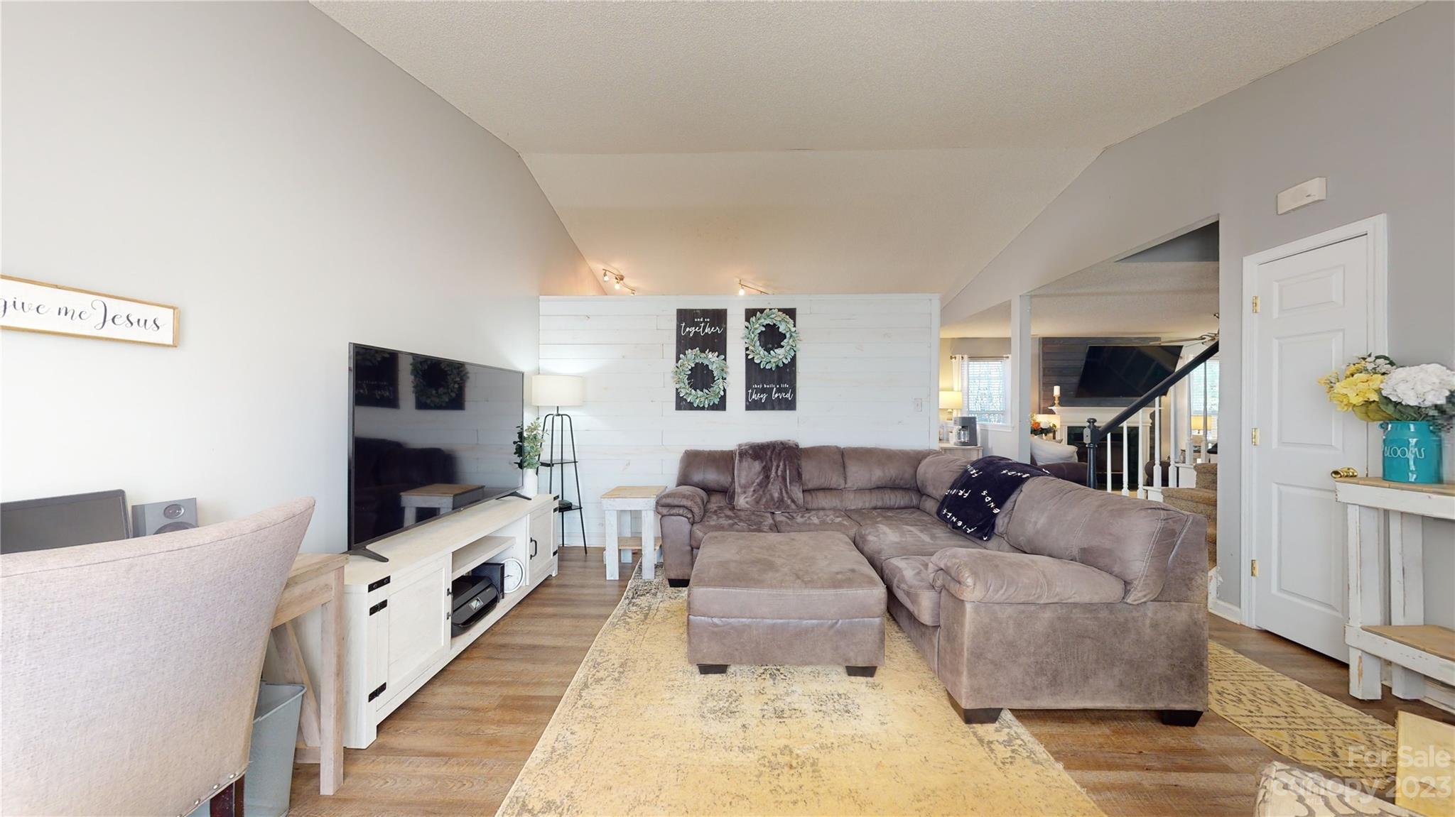 1007 Great Falls Drive Monroe, NC 28110 - Photo 3 of 45 a living room with furniture and a flat screen tv