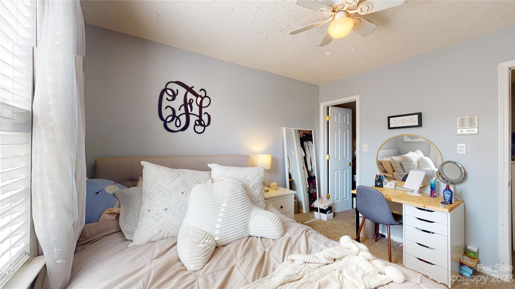 1007 Great Falls Drive Monroe, NC 28110 - Photo 31 of 45 a bedroom with bed and a mirror