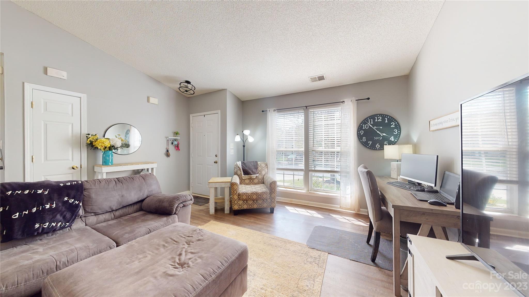 1007 Great Falls Drive Monroe, NC 28110 - Photo 4 of 45 a living room with furniture and wooden floor