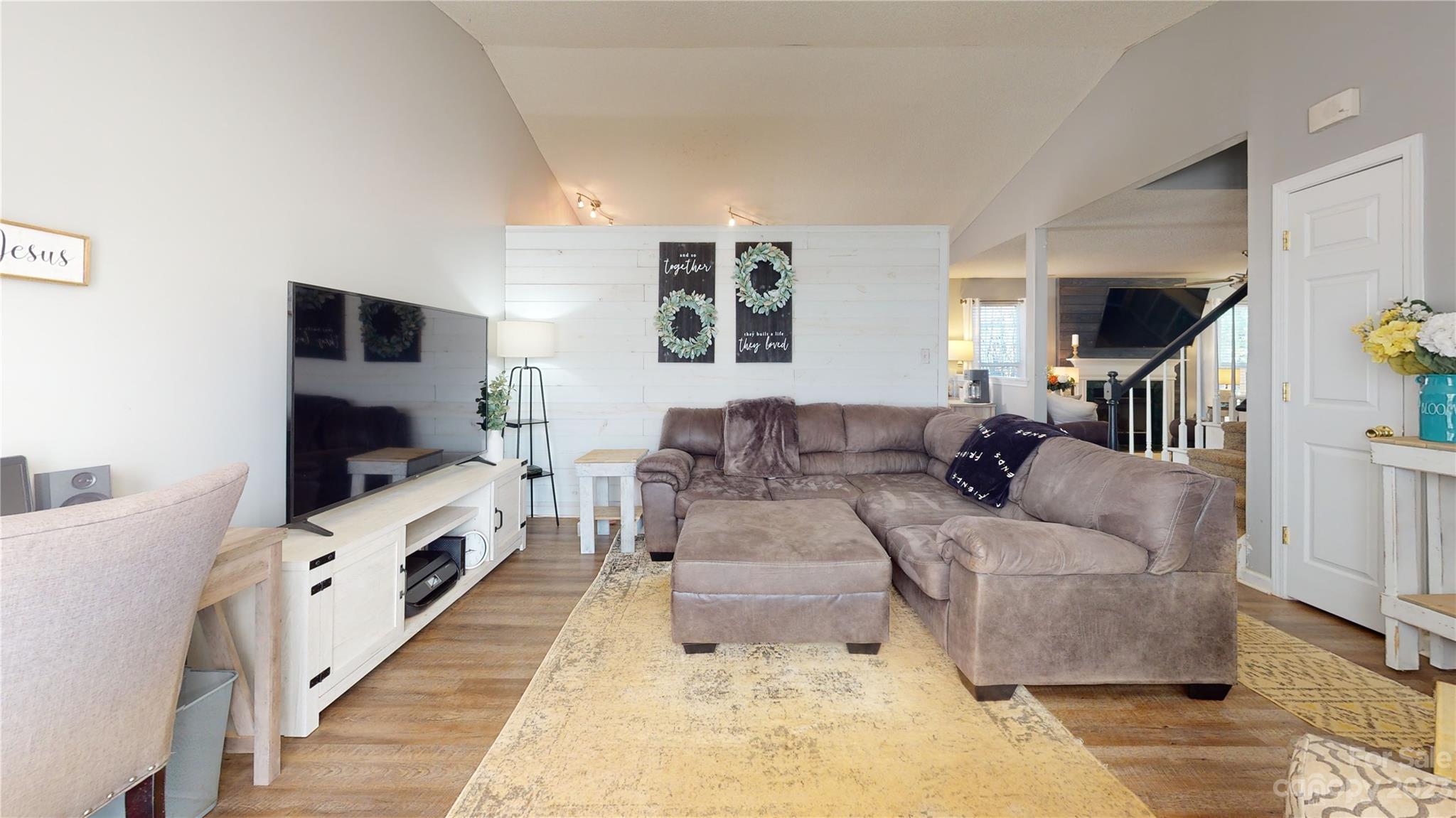 1007 Great Falls Drive Monroe, NC 28110 - Photo 41 of 45 a living room with furniture and a flat screen tv