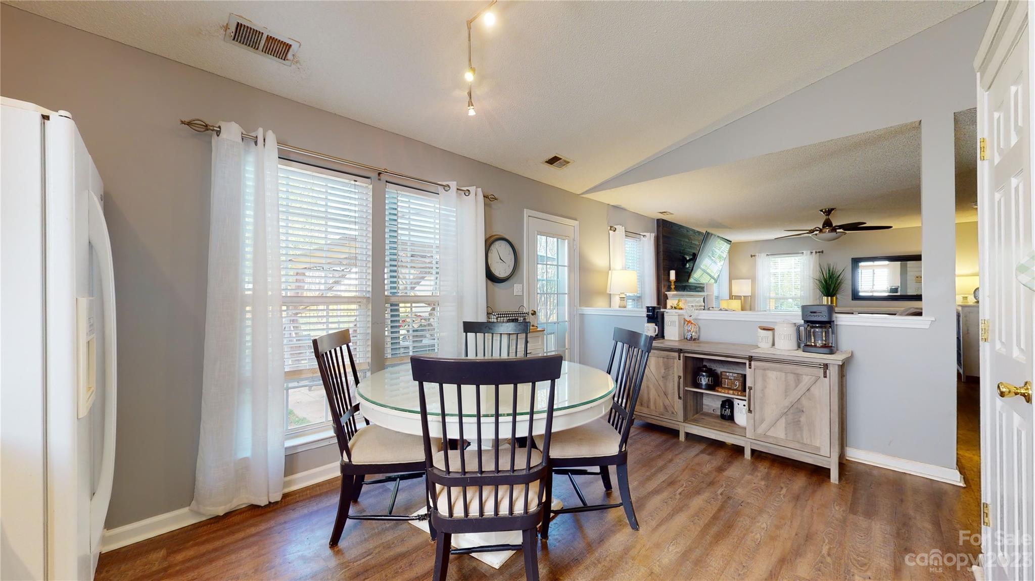 1007 Great Falls Drive Monroe, NC 28110 - Photo 9 of 45 a dining room with furniture and wooden floor