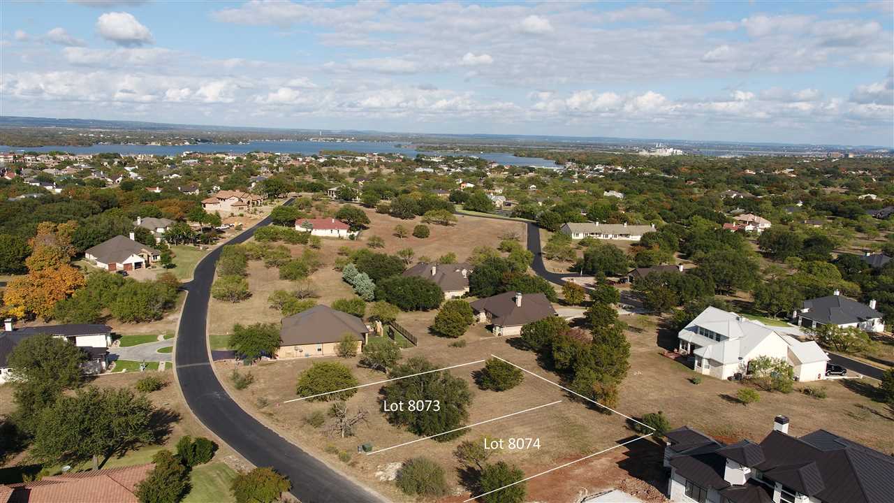 an aerial view of a residential houses with outdoor space