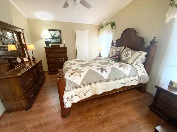 a bedroom with a bed and dresser