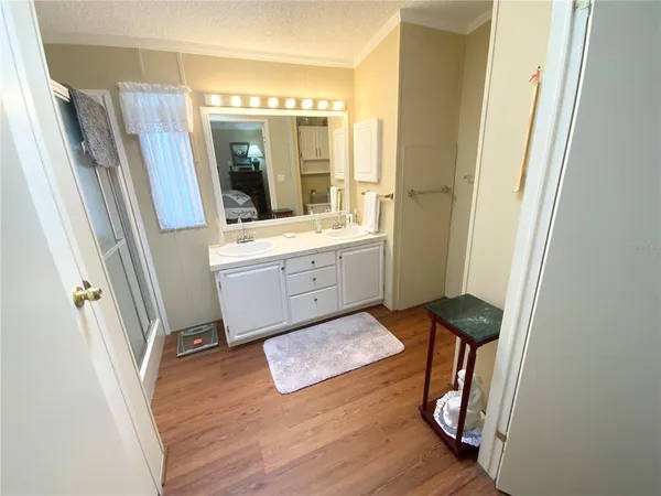 a bed room with a bed and a chair