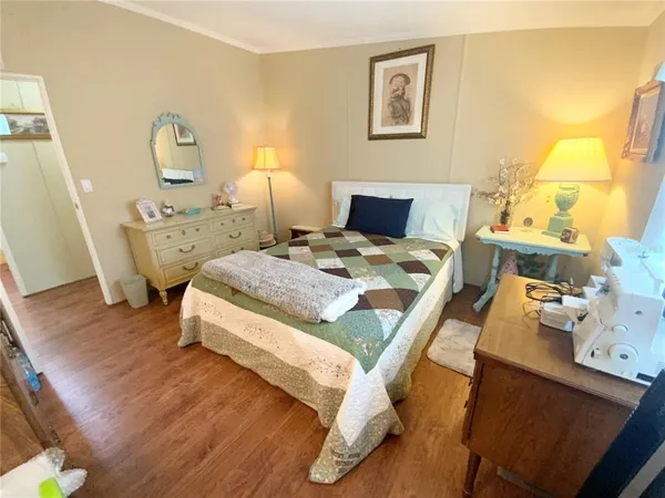 a bathroom with a sink toilet mirror and shower