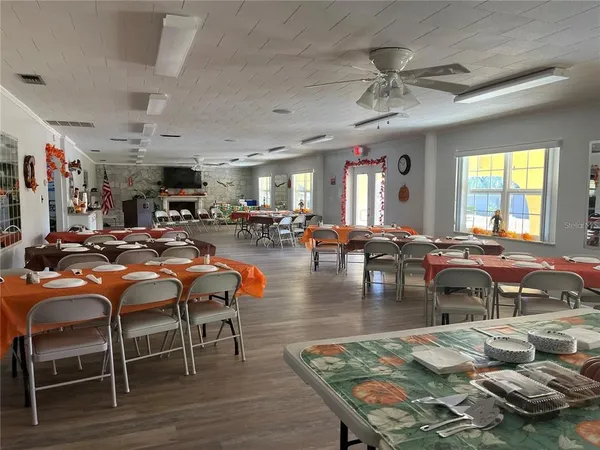 a living room with furniture and large window