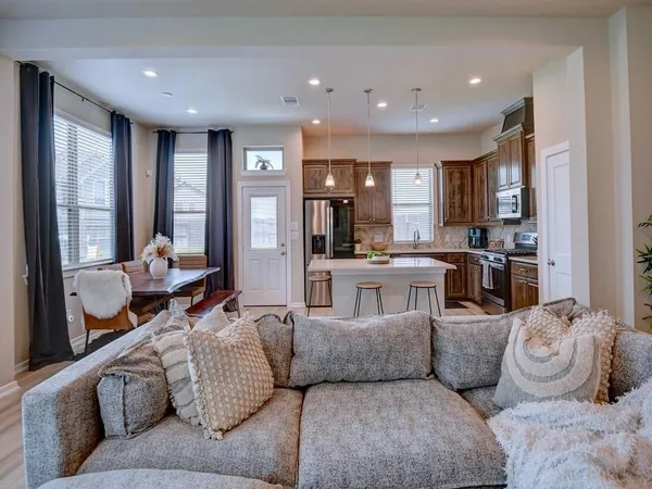 a living room with furniture and a large window