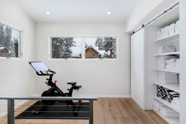 a view of workspace with furniture and wooden floor