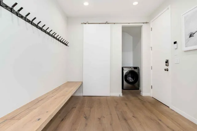 a view of a storage & utility room with wooden floor
