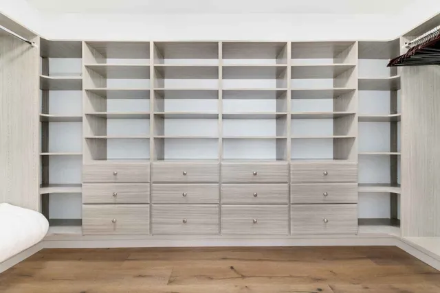 a view of a room with cabinets and shelf