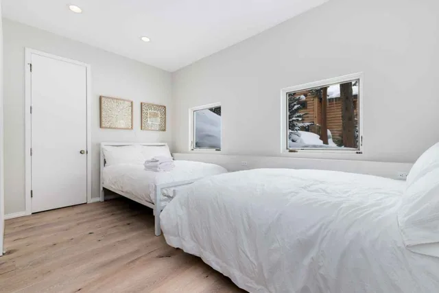 a bedroom with double bed and a window