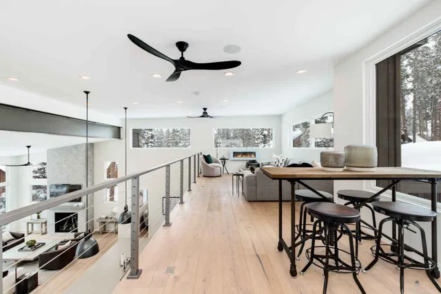a living room with lots of furniture and a wooden floor