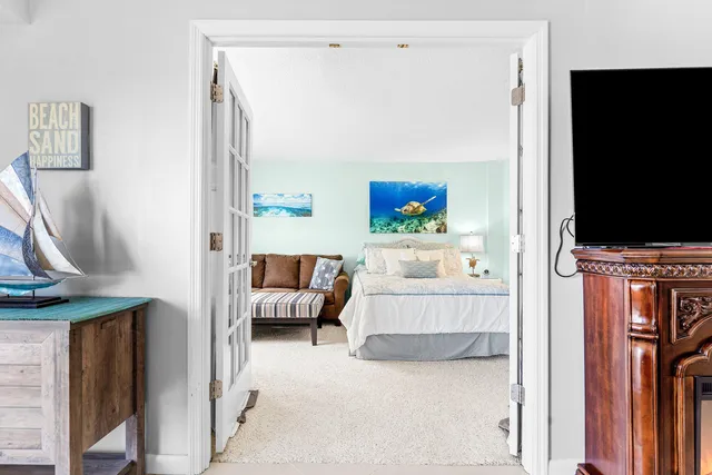 a bedroom with a bed and a lamp with table