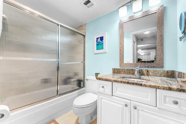 a reading room with furniture and a lamp