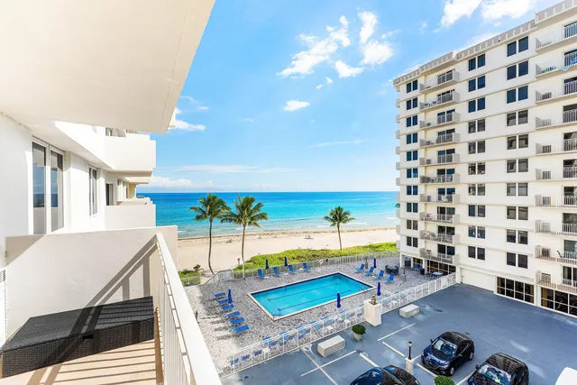 a view of swimming pool with outdoor seating