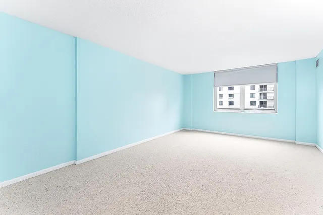 a view of swimming pool with outdoor seating