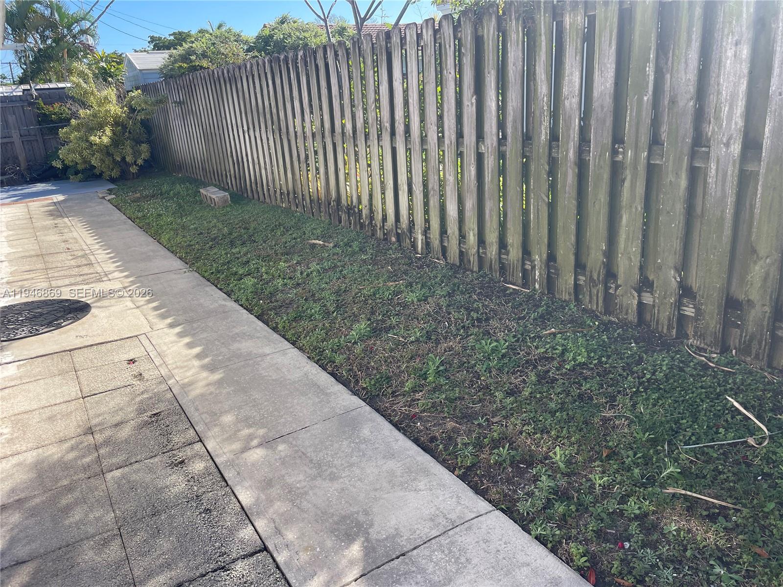 5550 Northeast 20th Terrace, Unit 3 Fort Lauderdale, FL 33308 - Photo 11 of 14 a view of wooden fence