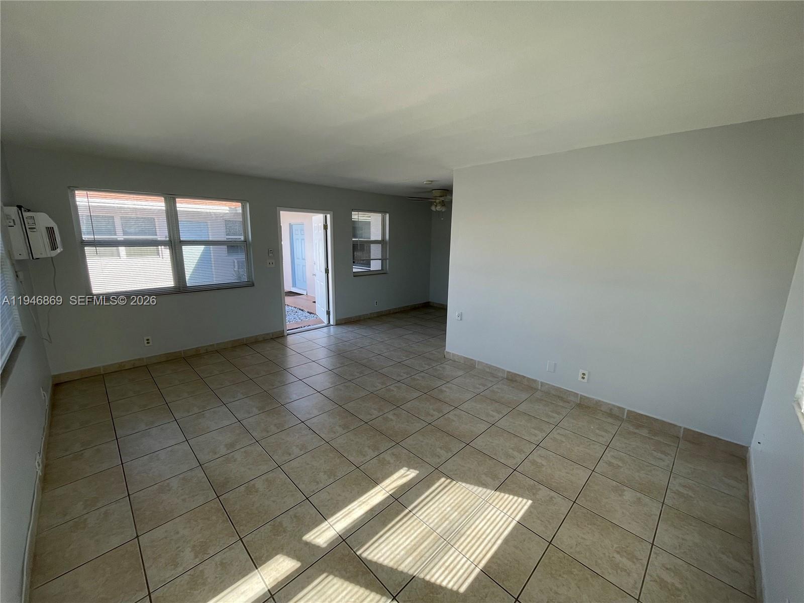 5550 Northeast 20th Terrace, Unit 3 Fort Lauderdale, FL 33308 - Photo 3 of 14 an empty room with windows