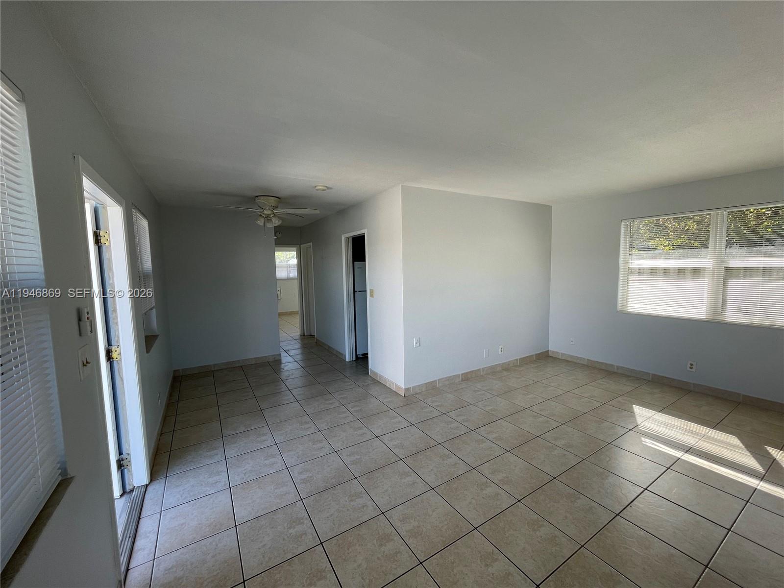 5550 Northeast 20th Terrace, Unit 3 Fort Lauderdale, FL 33308 - Photo 4 of 14 an empty room with windows