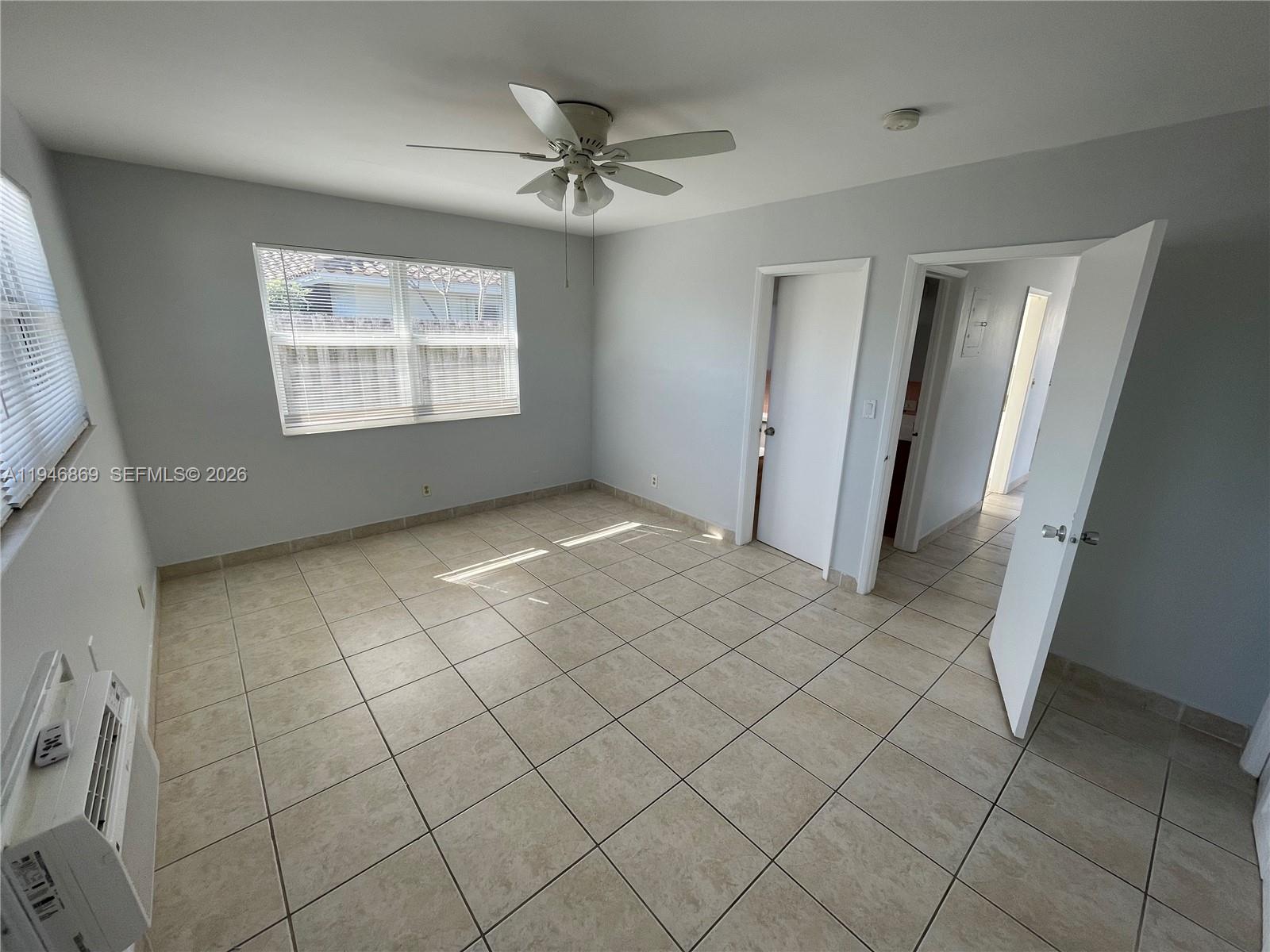5550 Northeast 20th Terrace, Unit 3 Fort Lauderdale, FL 33308 - Photo 7 of 14 a view of an empty room and window