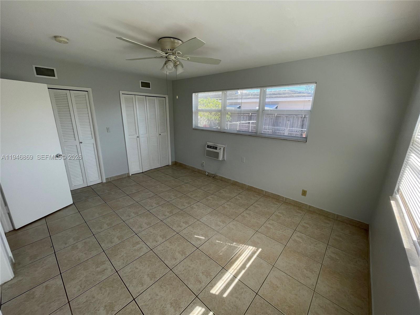 5550 Northeast 20th Terrace, Unit 3 Fort Lauderdale, FL 33308 - Photo 8 of 14 a view of an empty room with a window