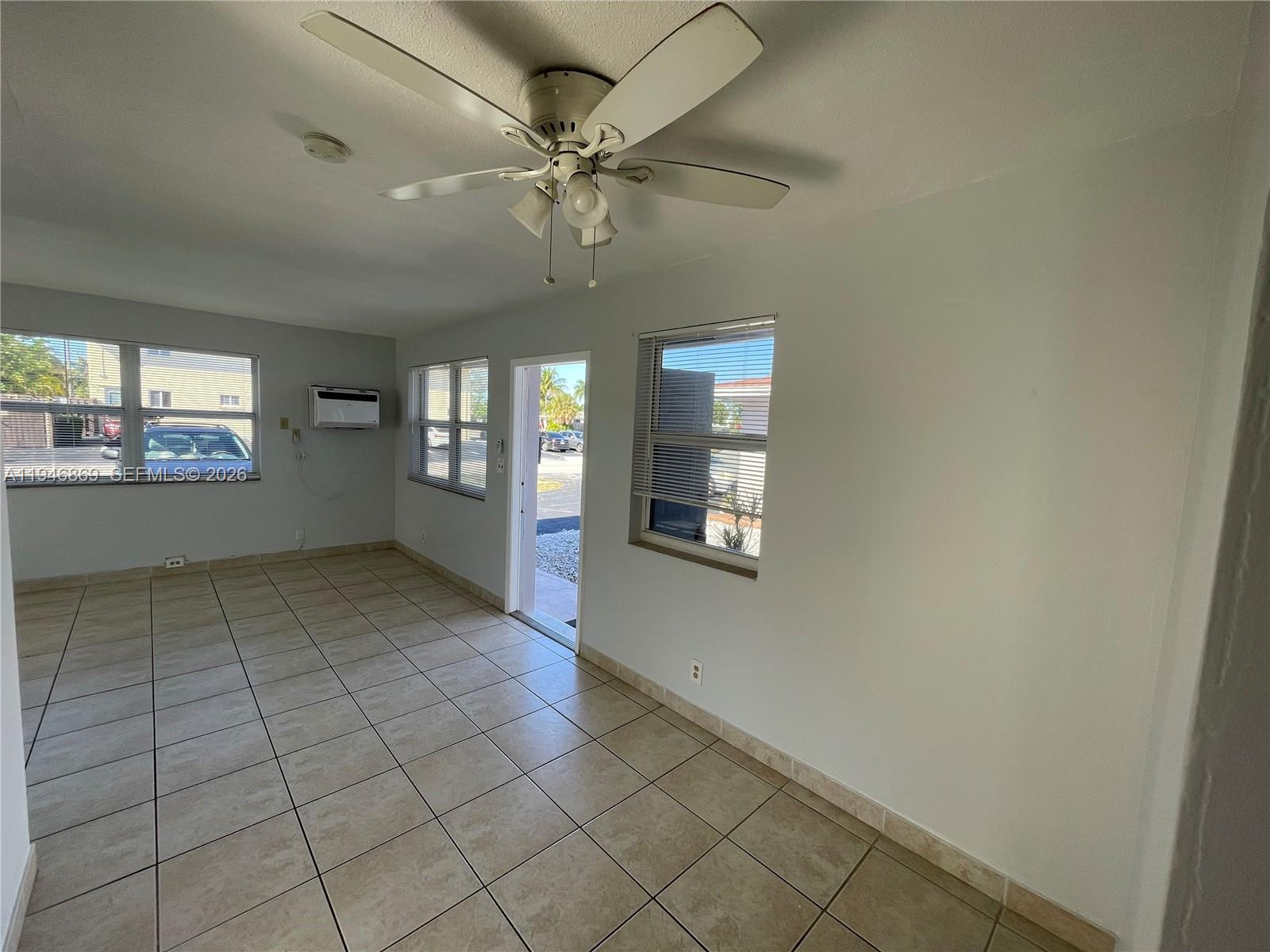 5550 Northeast 20th Terrace, Unit 3 Fort Lauderdale, FL 33308 - Photo 10 of 14 a view of an empty room and window